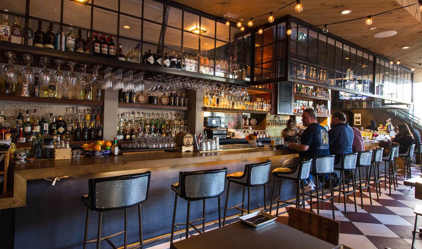 Interior, bar area, patrons at the bar